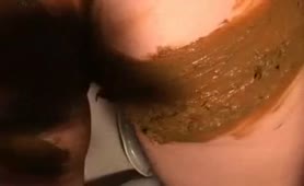 Rubbing brown poop on her entire body