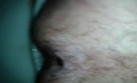 Hairy guy shitting over the toilet