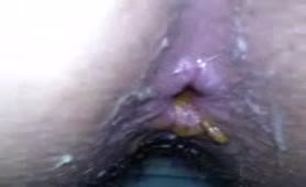 Close up of a shaved wife pooping