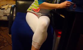 Young girl peeing in tight white pants