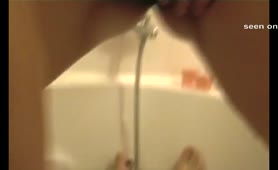 Shaved teen peeing in bathtub