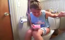 Sexy teen shitting in toilet