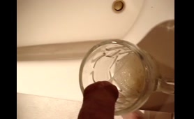 Woman Fills Glass with Piss