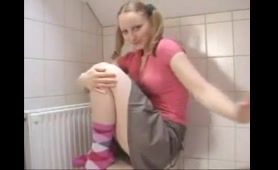 Woman drops a nasty load in the bathroom