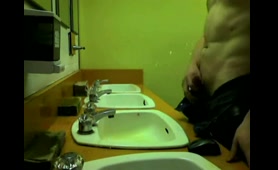 Guy Takes a Piss Over the Sink