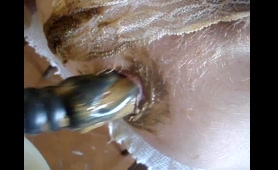 Hairy Lady Dumps a Load with Dildo