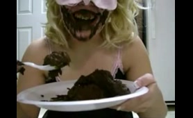 Masked Woman Eats Shit from a Plate