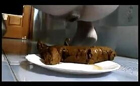 Brown turd on a white plate