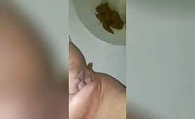 Brown shit over toilet