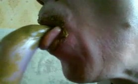 Sucking a scat dildo