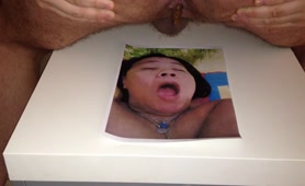 Guy shitting on a photo