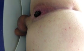 Mature man pooping in close up