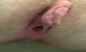 Close up of shaved babe shitting