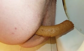 Hairy guy shitting in toilet